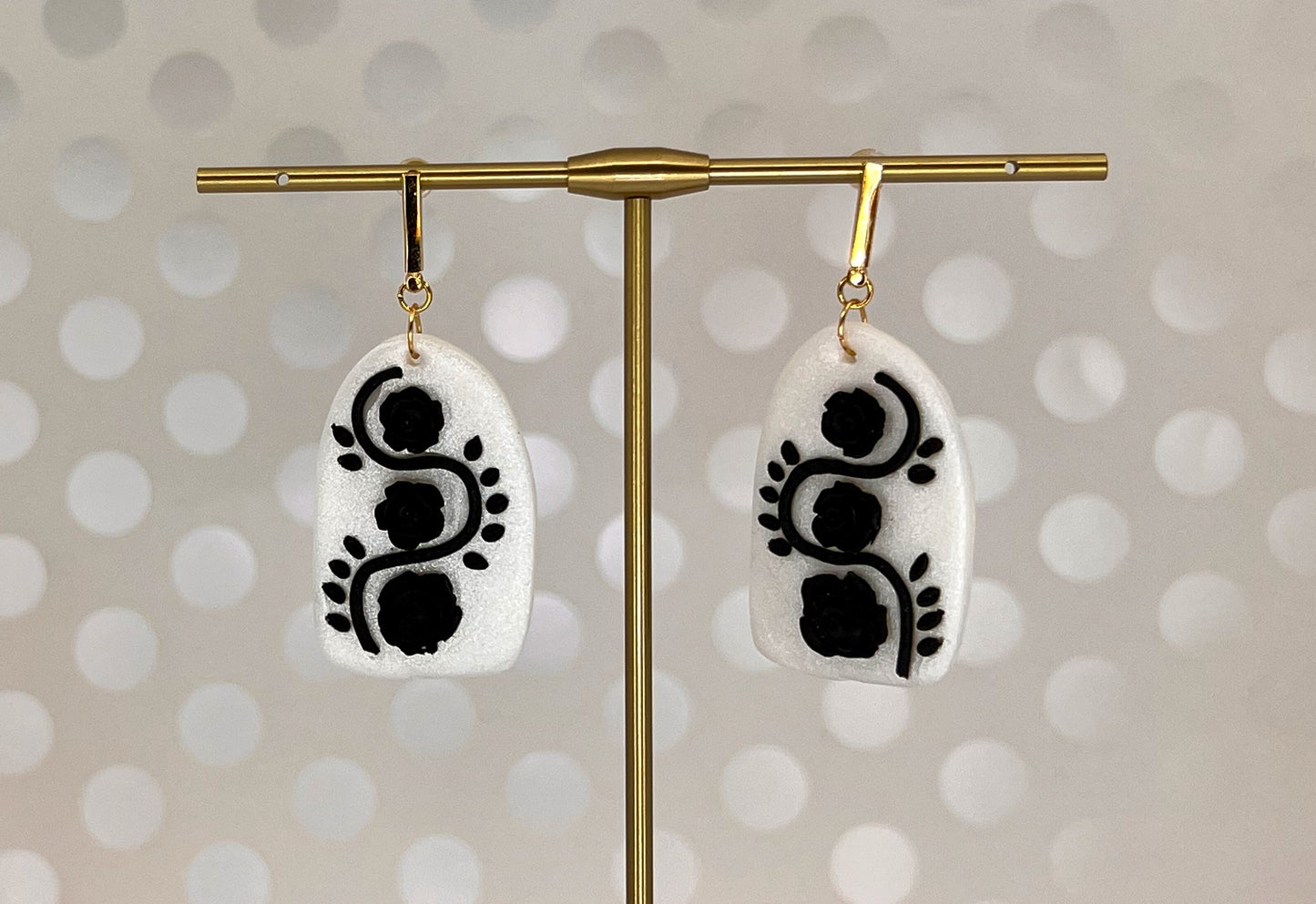 White plated medium lightweight Gold Earrings clay Black